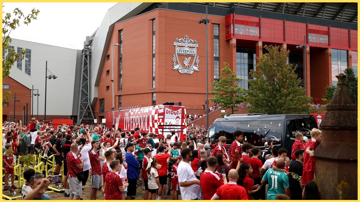 Liverpool fans greet the team bus outside Anfield