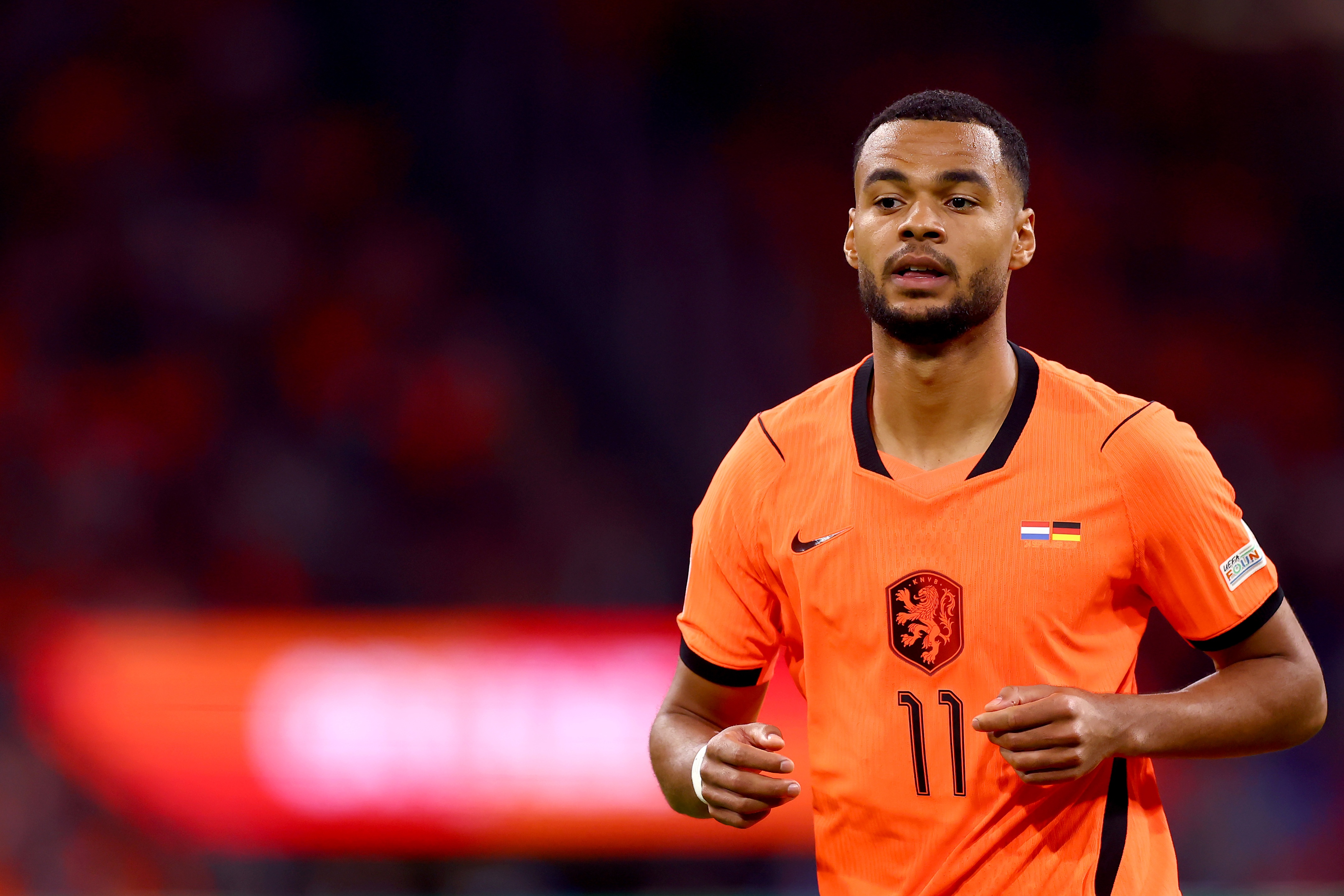 Livepool winger Cody Gakpo runs on the pitch for the Netherlands.