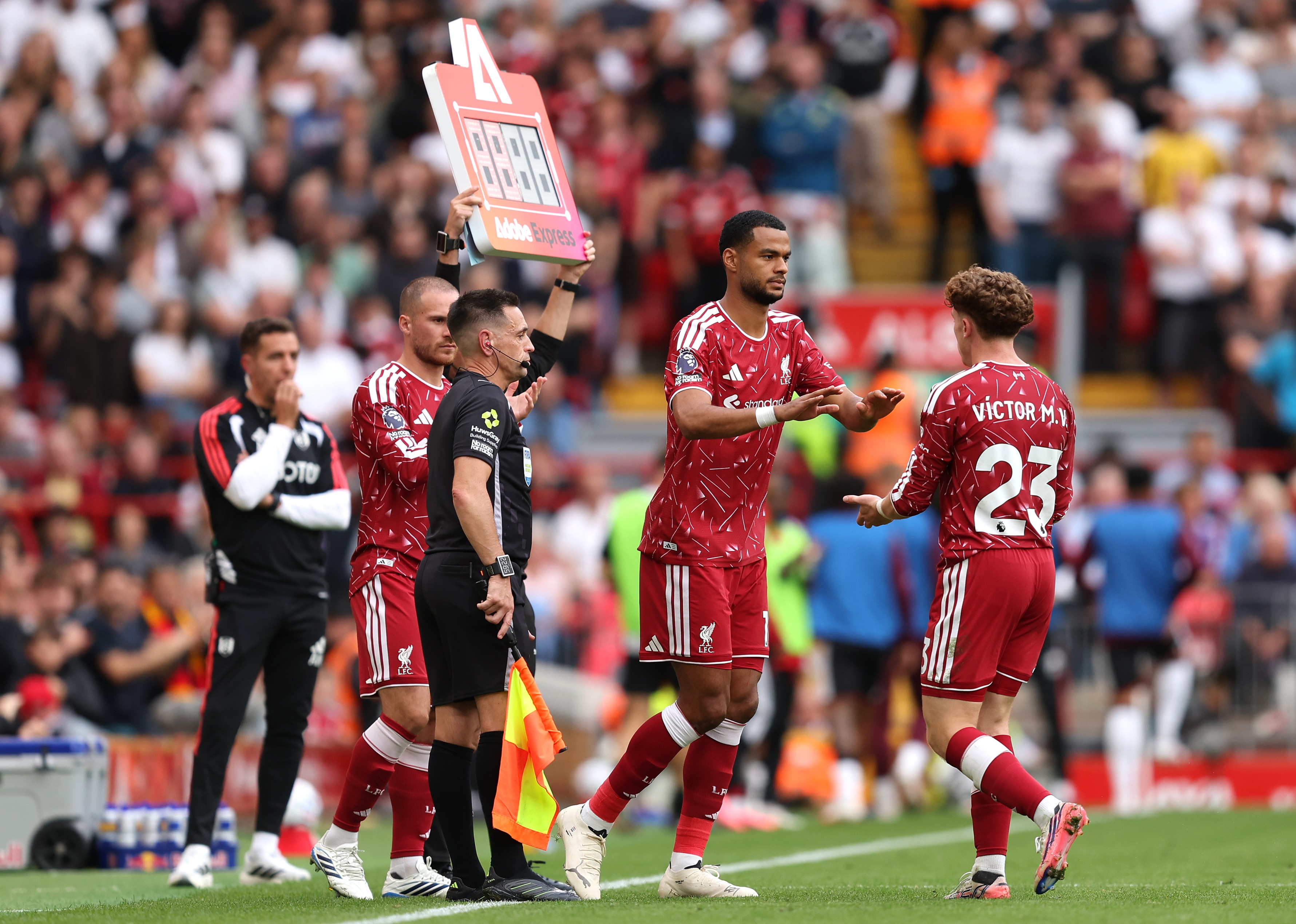 Victor Munoz prepares to high five Liverpool teammate Cody Gakpo.