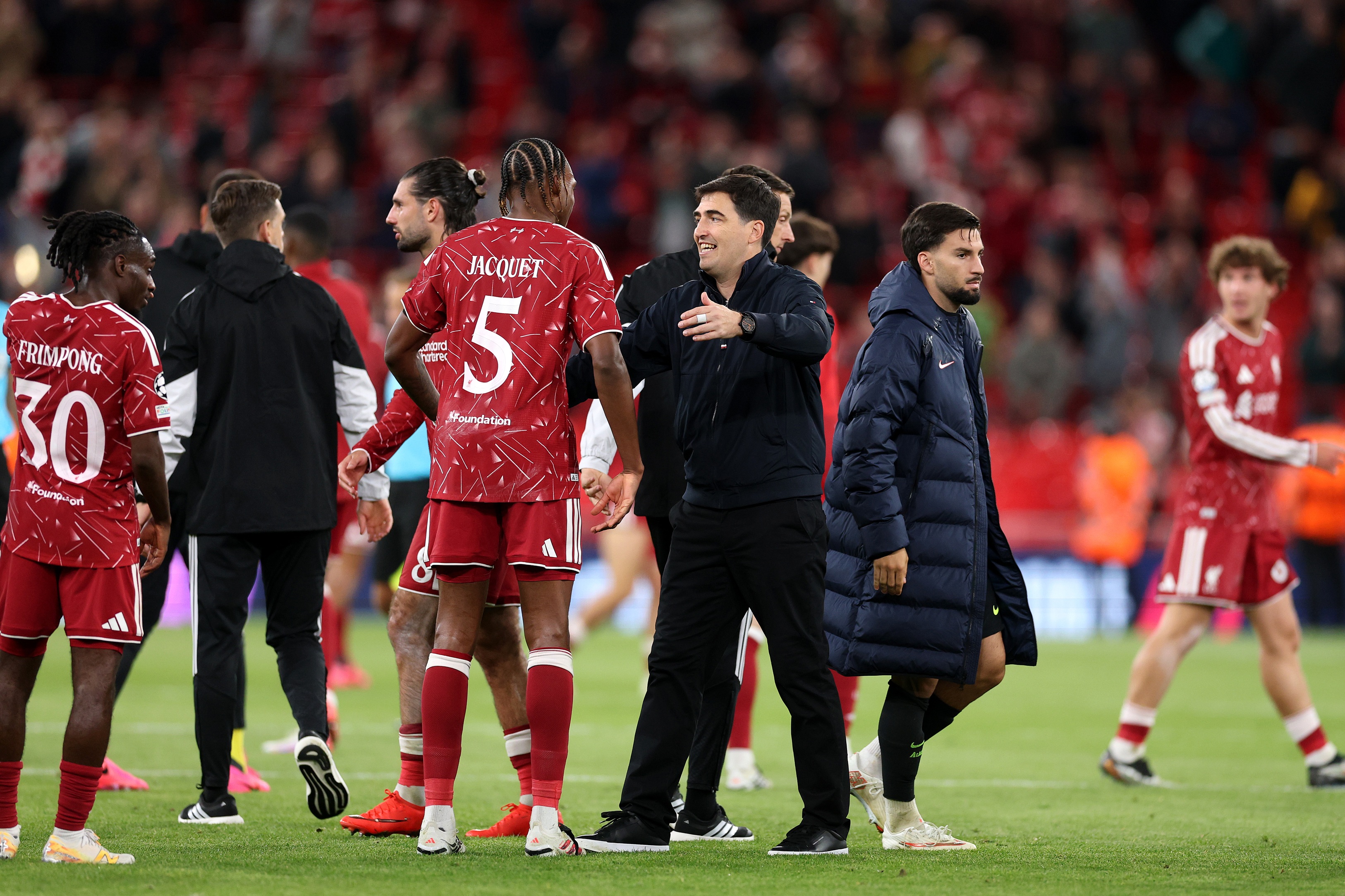 Liverpool manager Andoni Iraola congratulates centre-back Jeremy Jacquet.