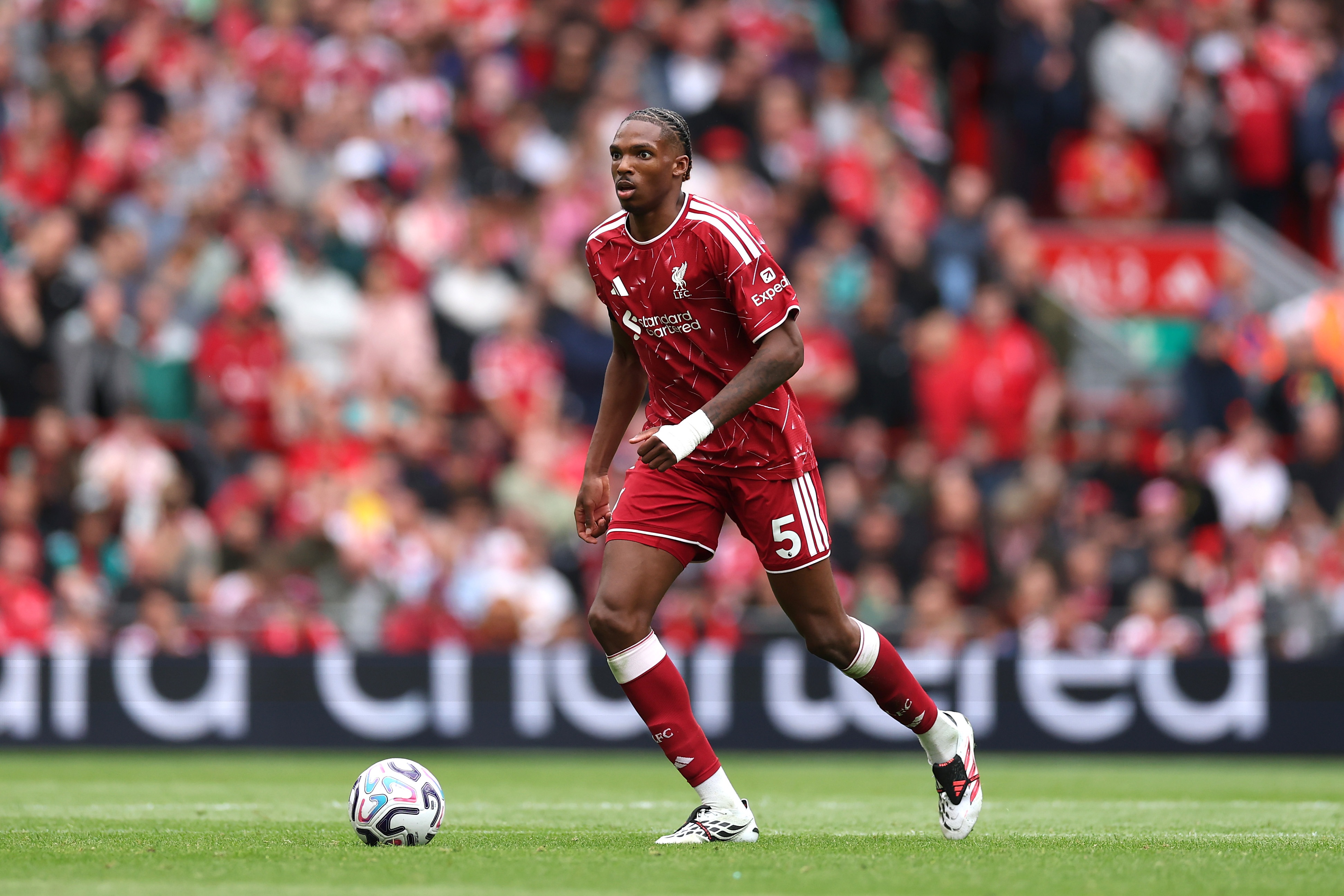 Liverpool centre-back Jeremy Jacquet dribbles on the ball.
