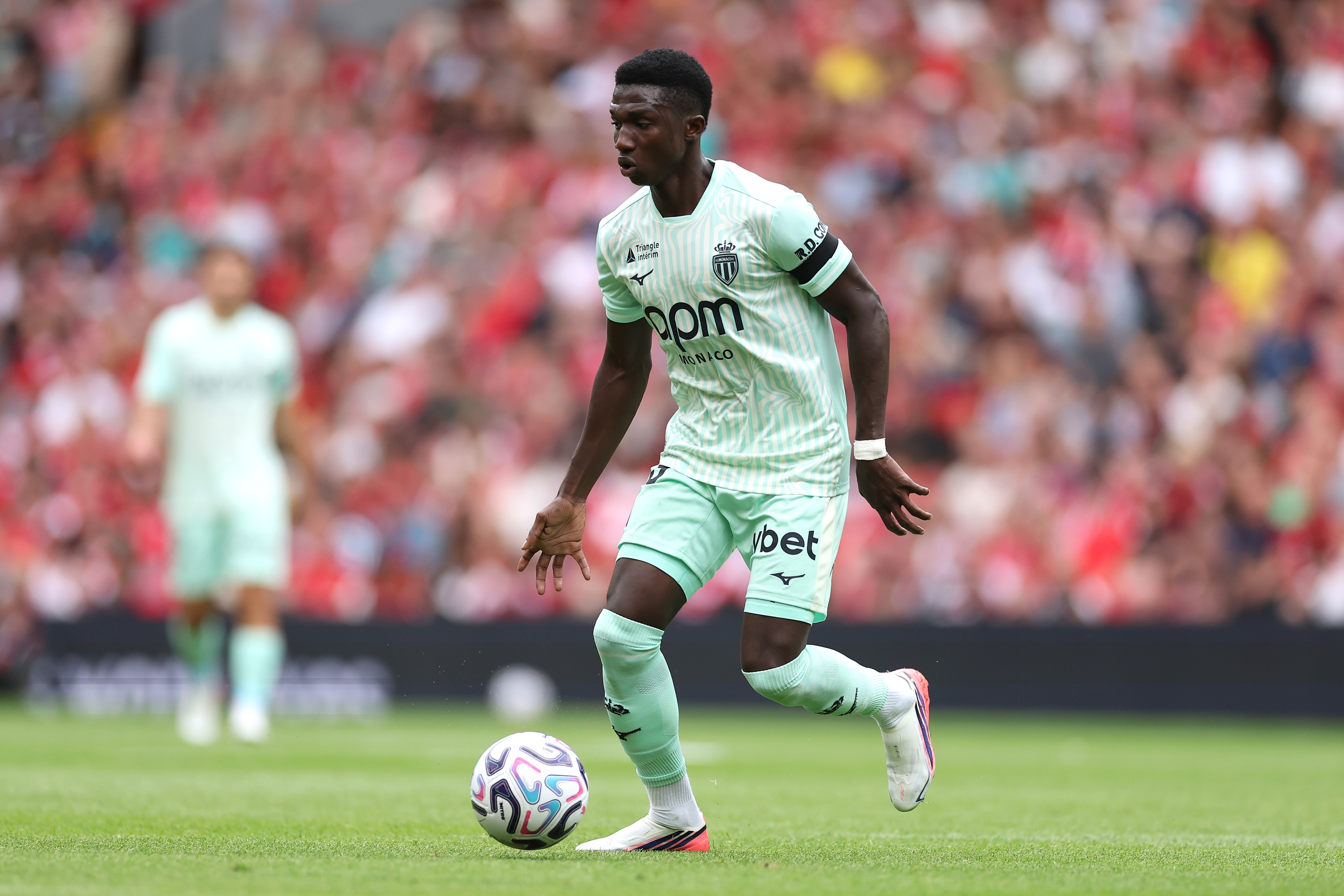 Liverpool and Chelsea transfer target Lamine Camara dribbles with the ball for Monaco.