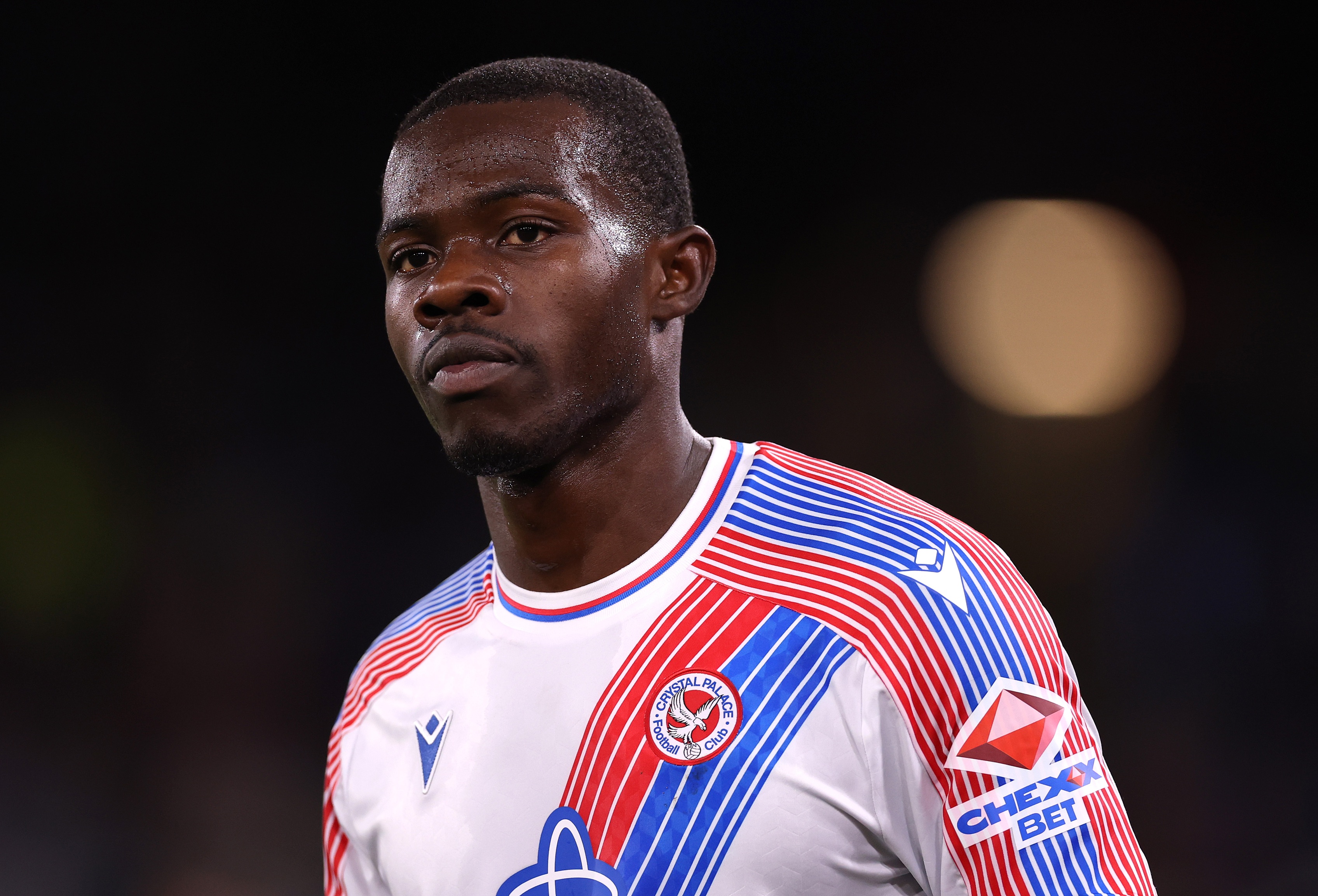 Tyrick Mitchell looks on during Crystal Palace game.