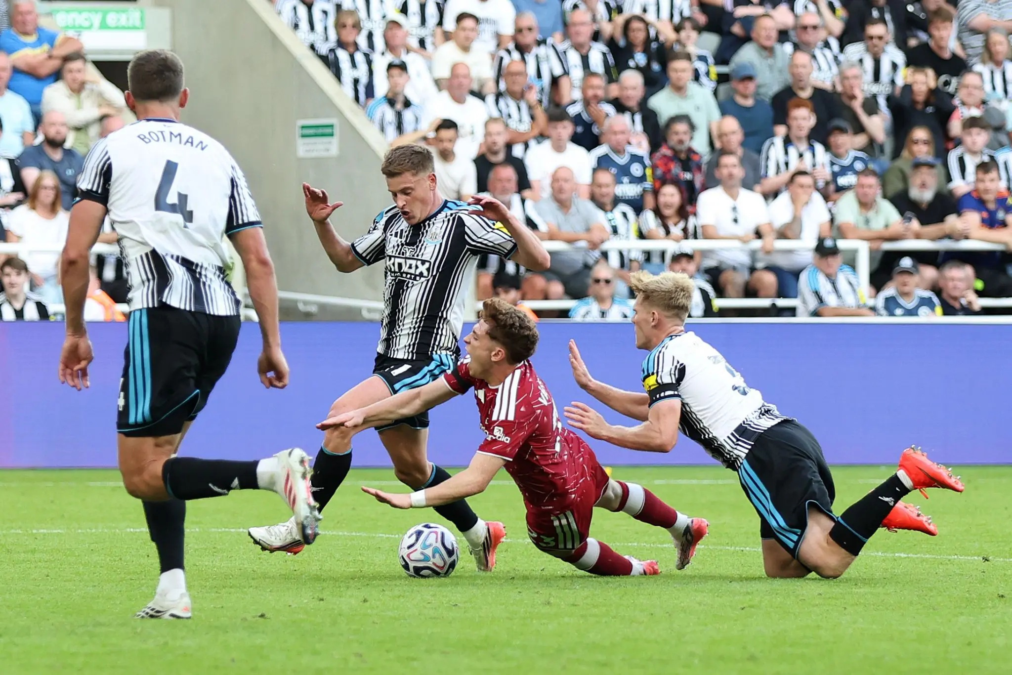 Lewis Hall brings down Victor Munoz at St James' Park