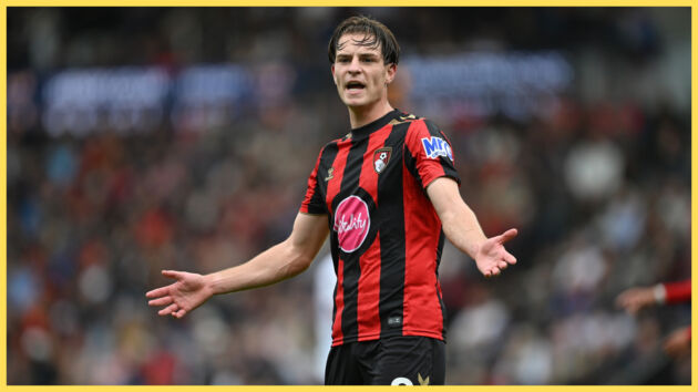 Alex Scott holds his arms out wide during Bournemouth game.