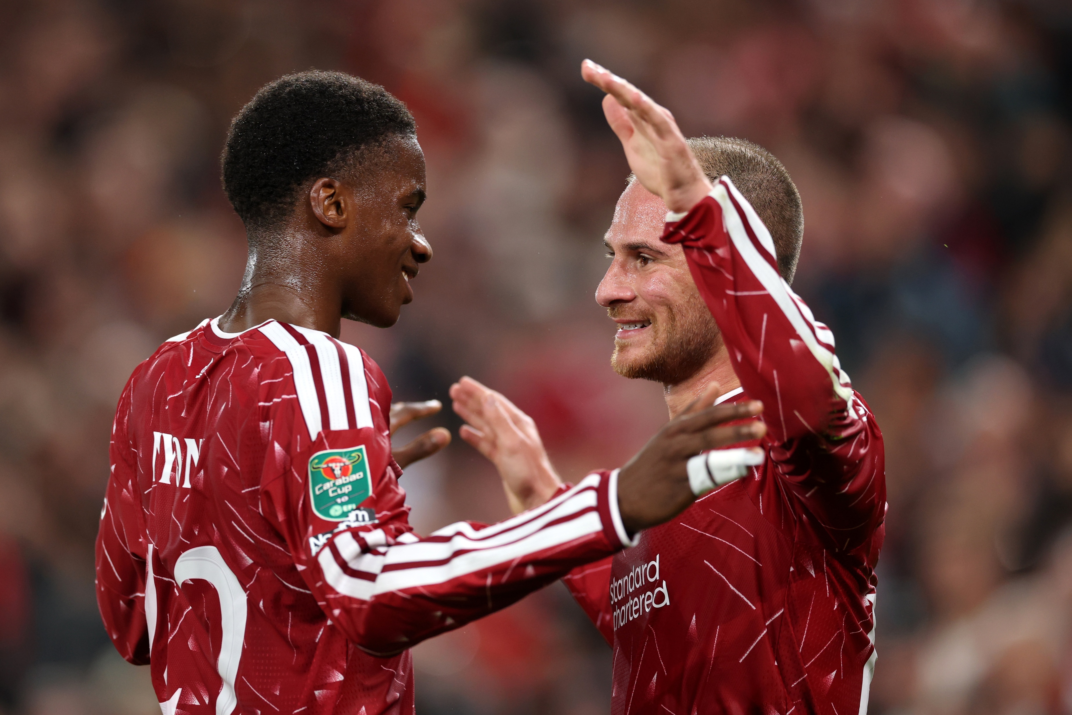 Alexis Mac Allister celebrates with Liverpool midfielder Trey Nyoni.