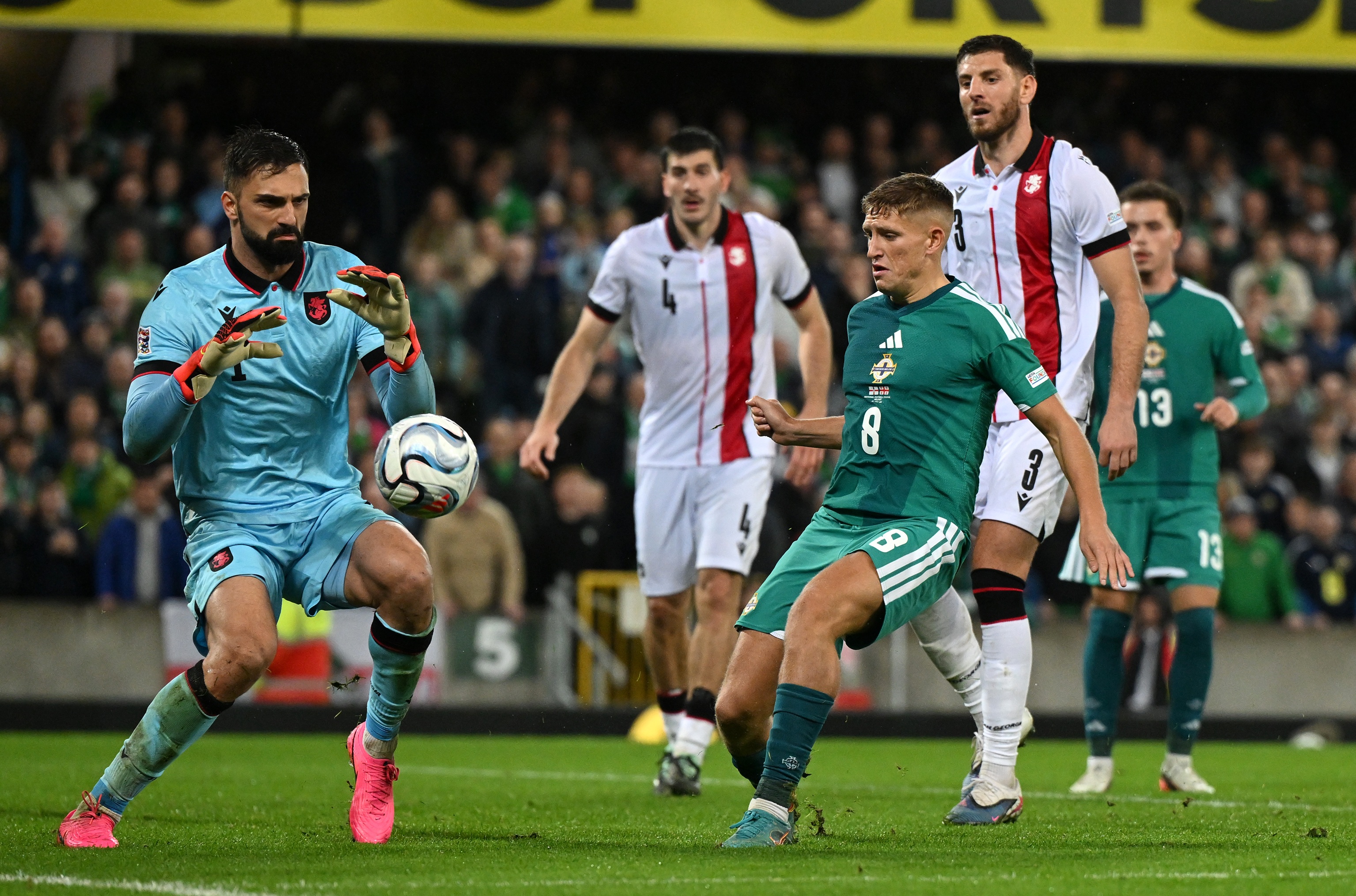 Giorgi Mamardashvili looks to gather a loose ball.