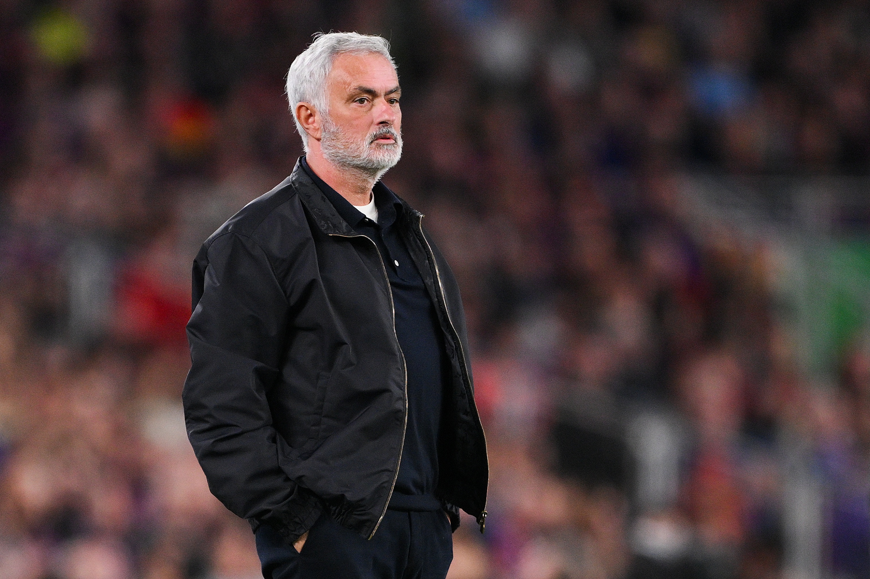 Real Madrid manager Jose Mourinho stands with his hands in his pockets.