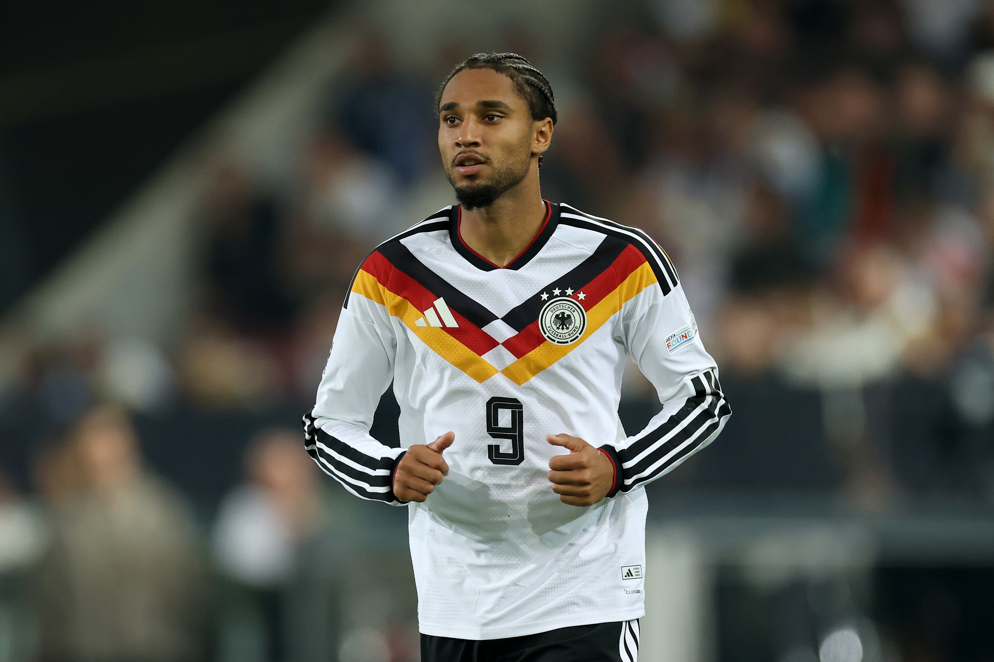 Liverpool transfer target Kevin Schade runs on the pitch for Germany.