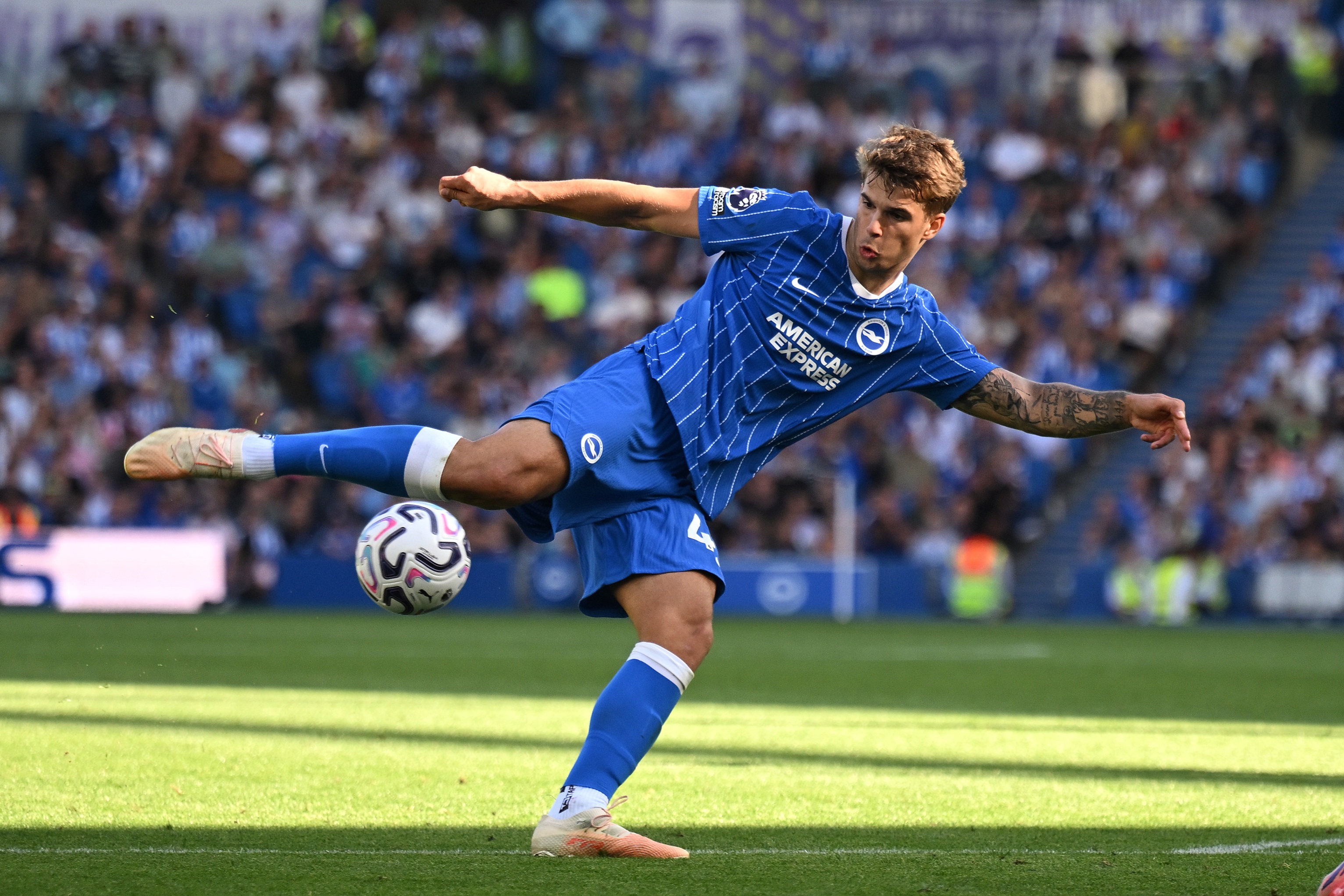 Brighton centre-back Luka Vuskovic angles his body to volley a football in mid-air.