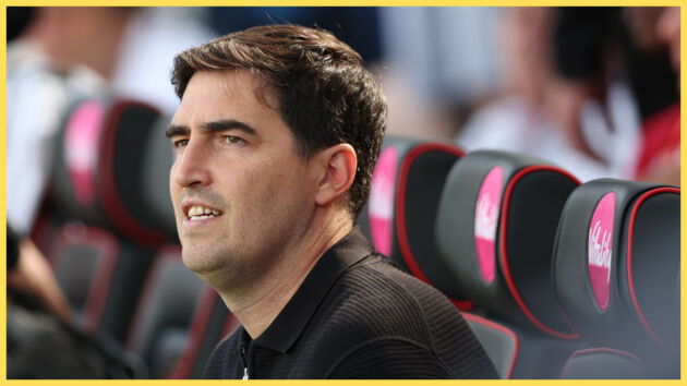 Liverpool head coach Andoni Iraola looks on from the bench.