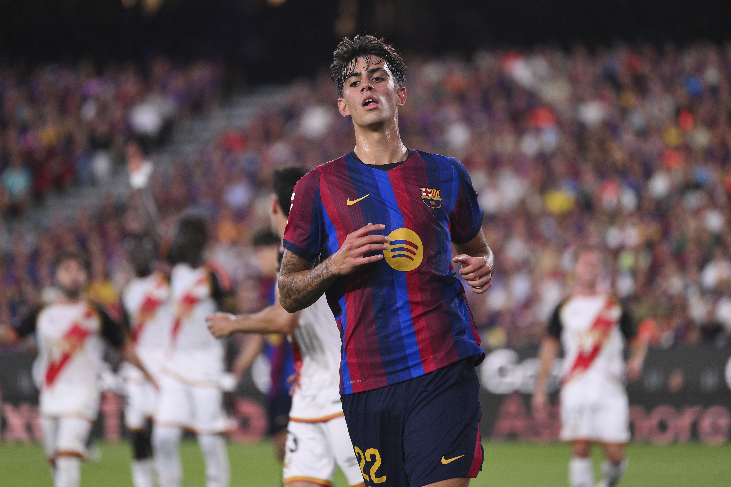 Liverpool transfer target Marc Bernal runs on the pitch for Barcelona.
