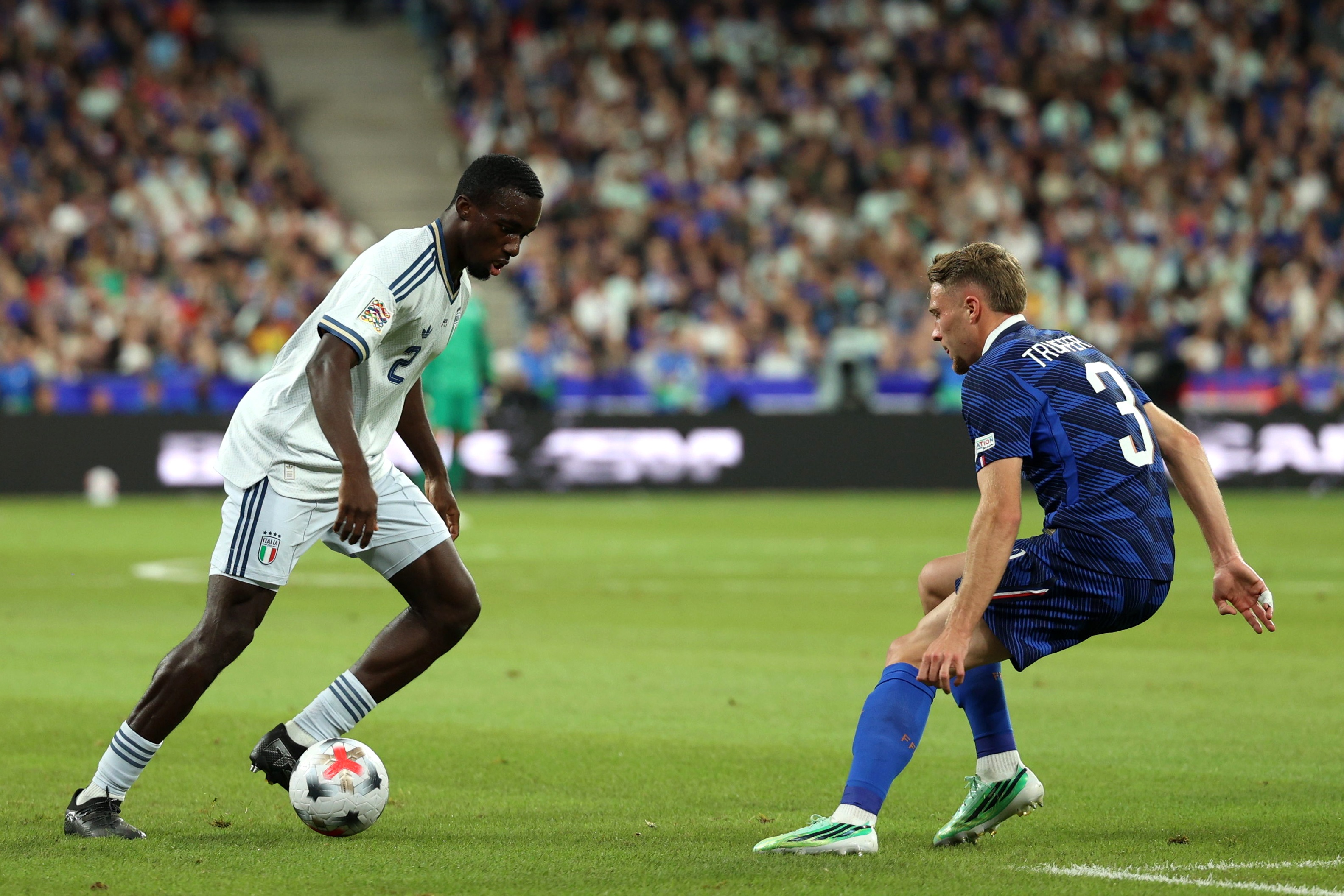Liverpool transfer target Michael Kayode dribbles against a France player.