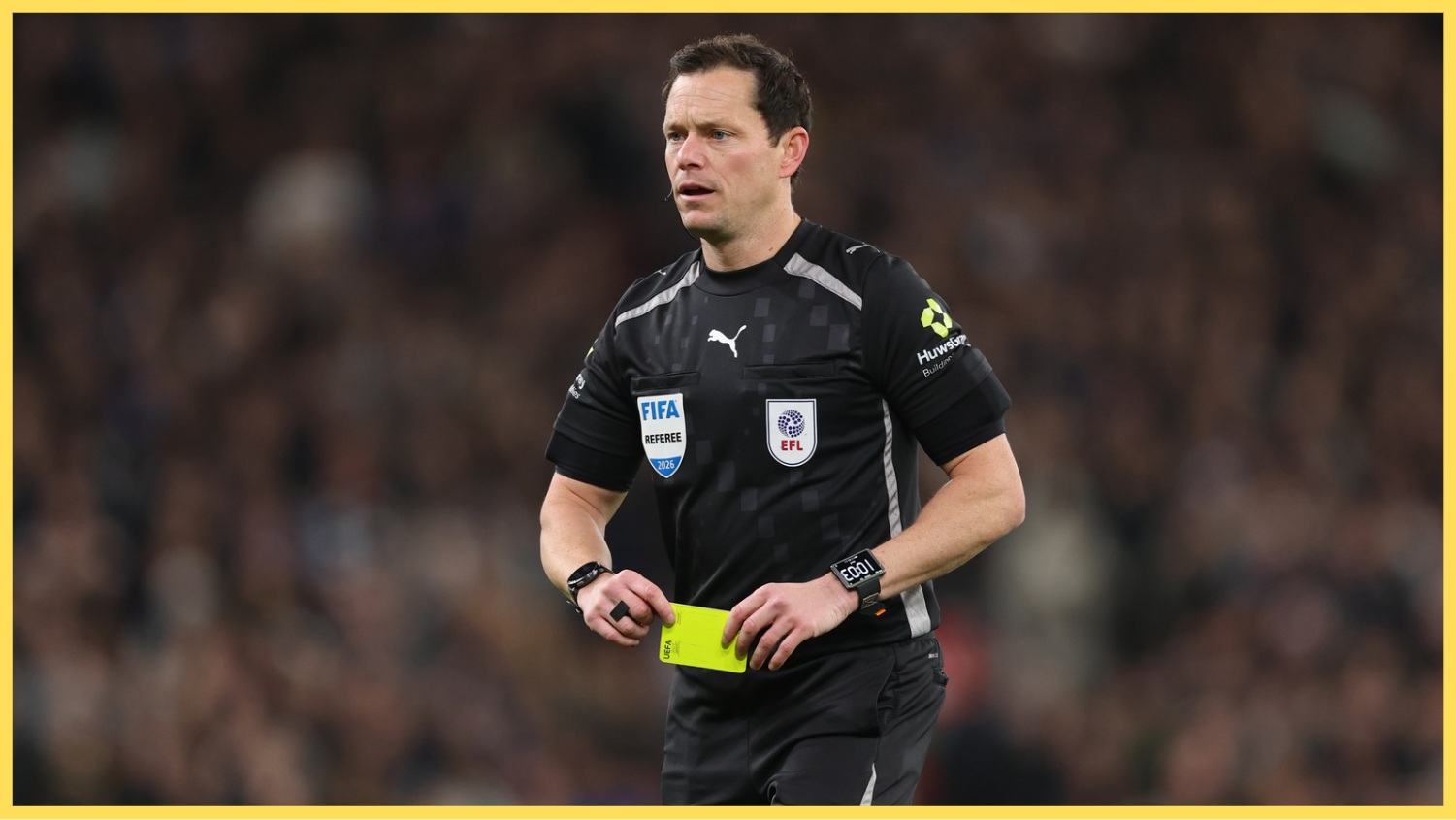 Darren England takes out a yellow card