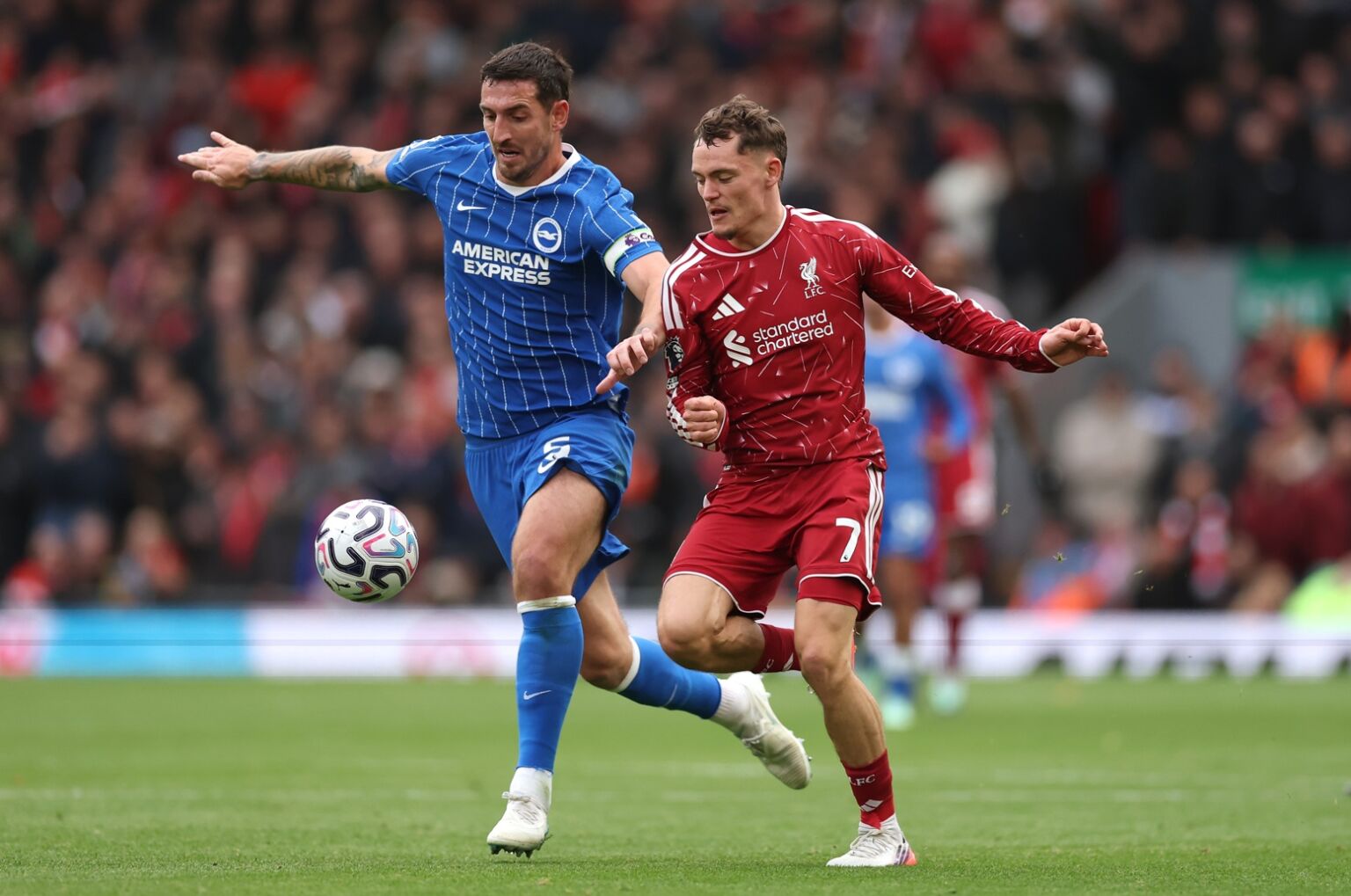 Lewis Dunk and Florian Wirtz battle for possession