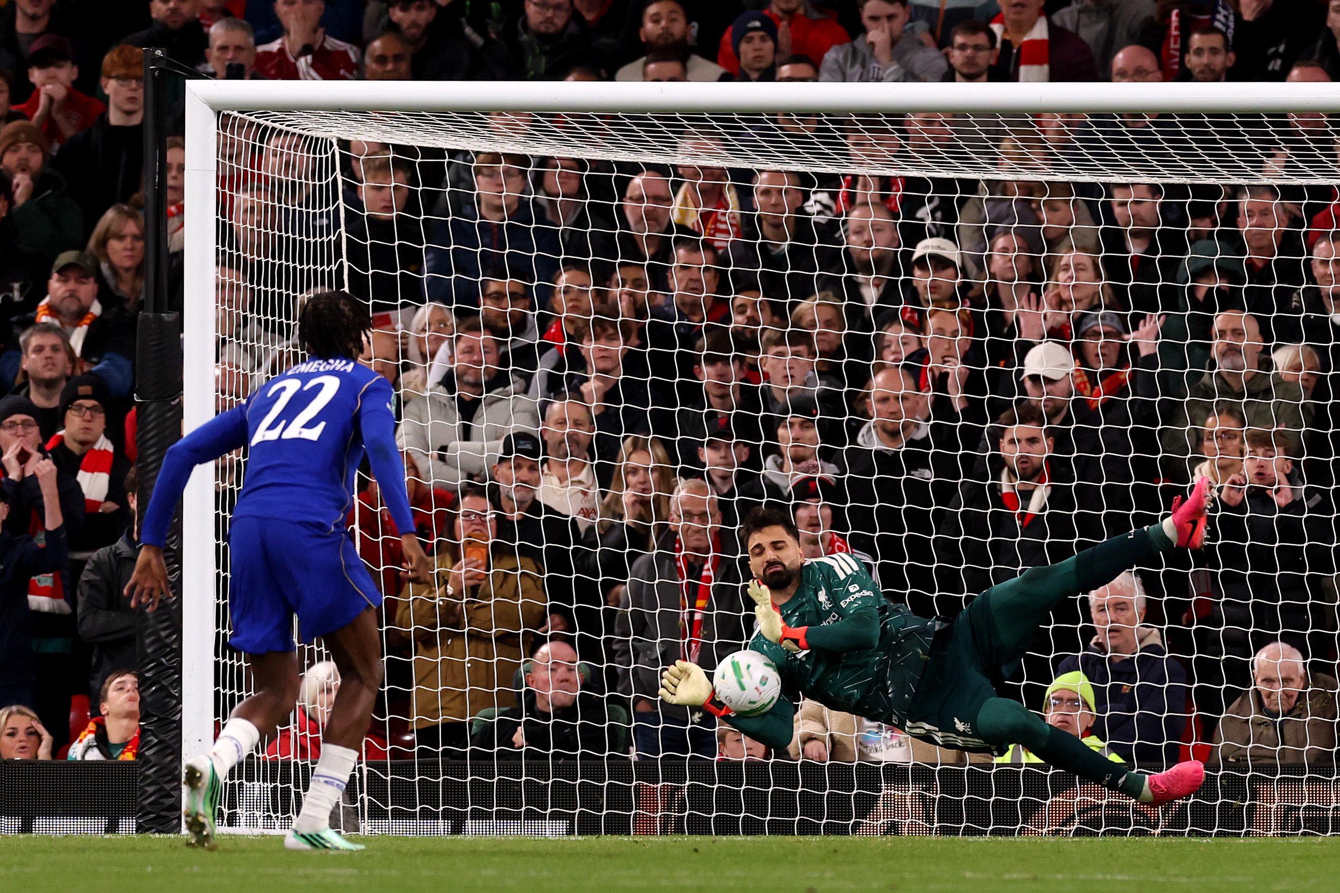 Giorgi Mamardashvili saves from Emmanuel Emegha in Liverpool's penalty shootout win over Chelsea