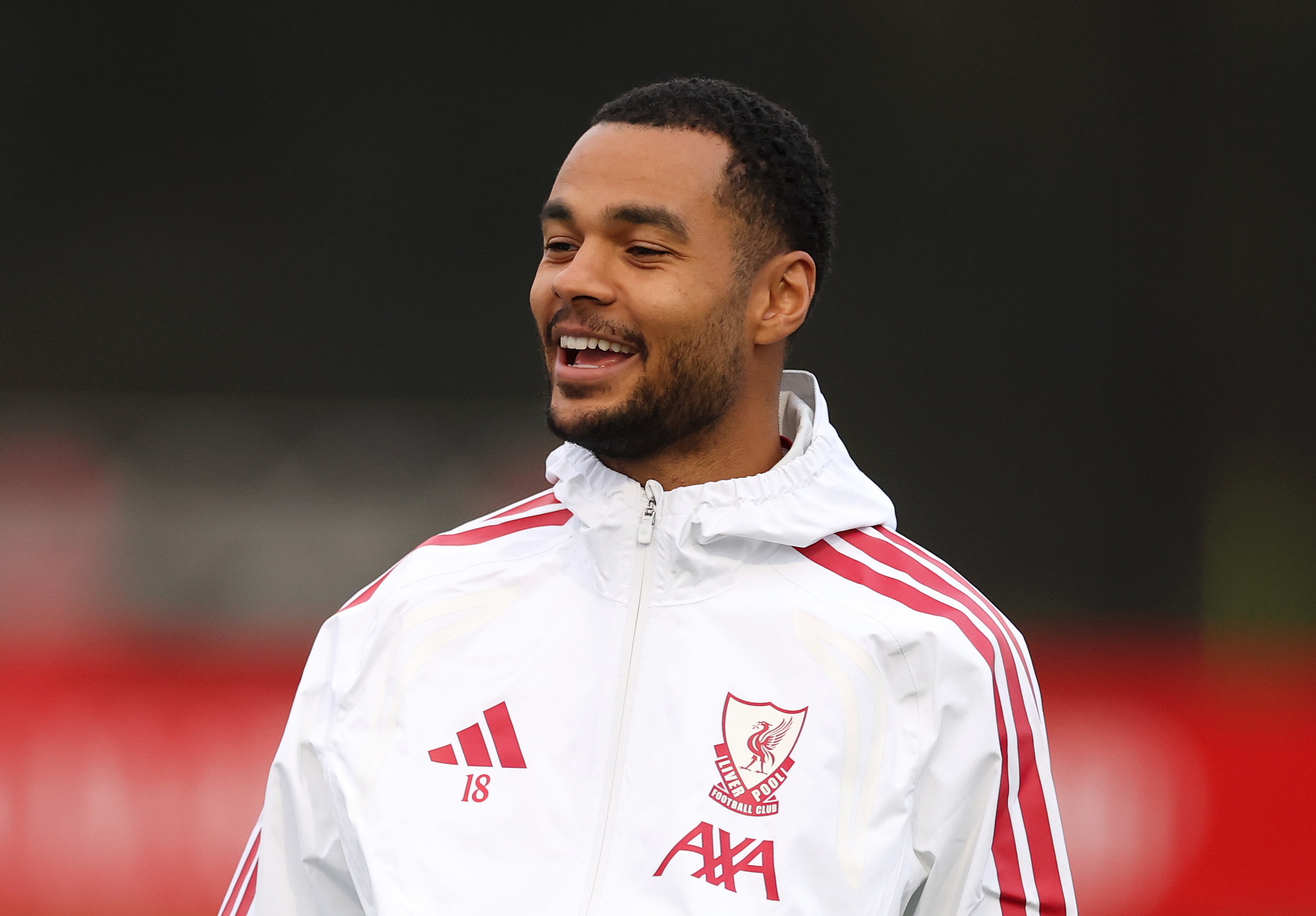 Cody Gakpo smiles during a Liverpool training session