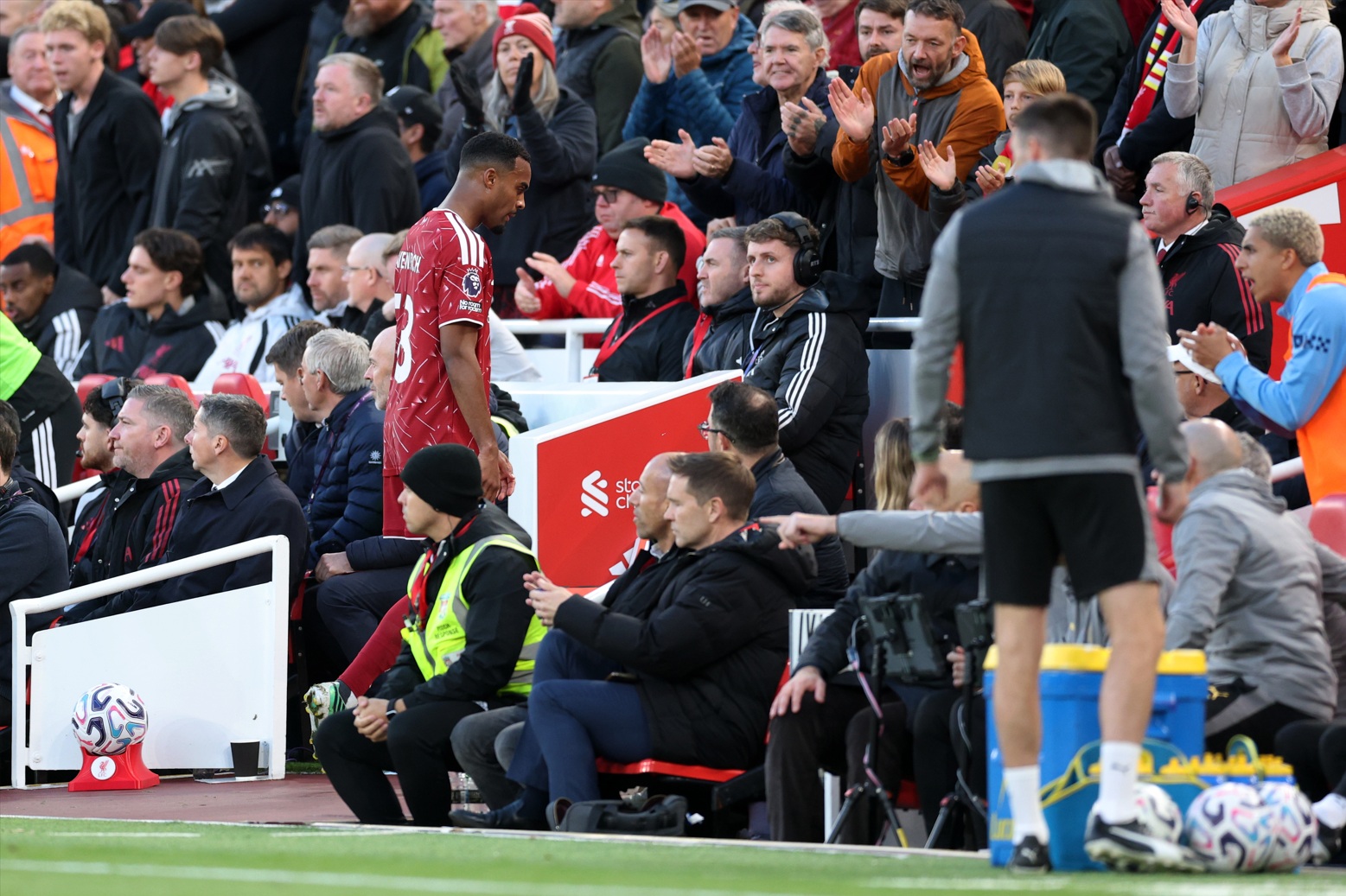 Ryan Gravenberch walks off the pitch after being shown a red card by Chris Kavanagh
