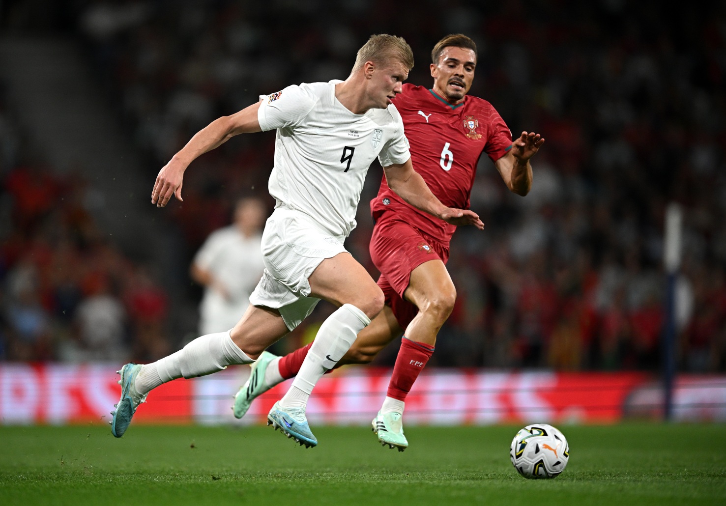 Erling Haaland is closed down by Joao Palhinha