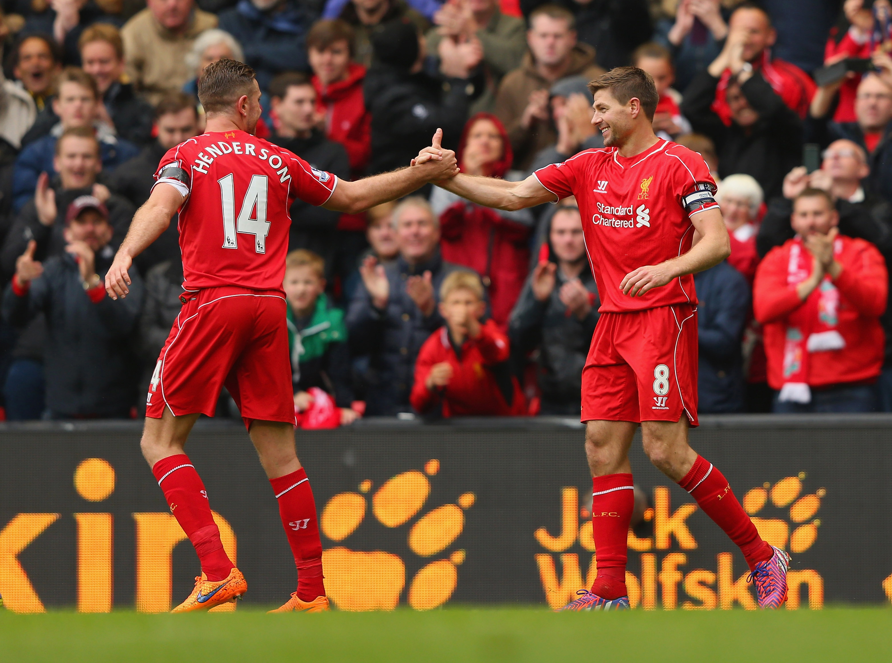 Jordan Henderson and Steven Gerrard celebrate a goal for Liverpool in 2015
