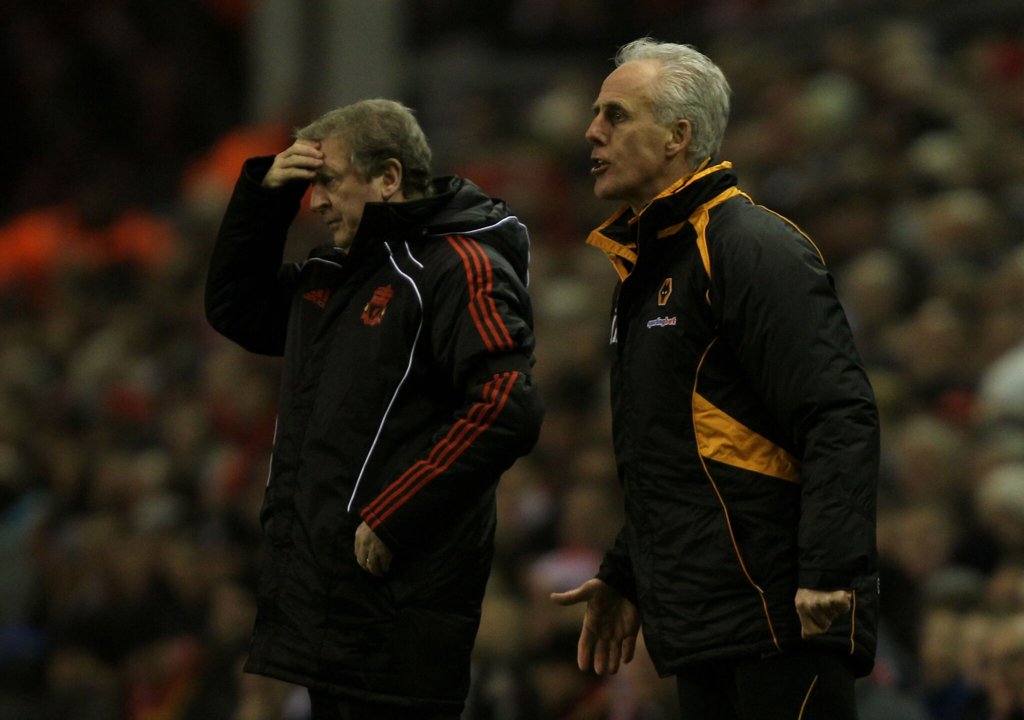 Roy Hodgson and Mick McCarthy watch on from the touchline at Anfield in December 2010