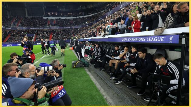 Andoni Iraola and the Liverpool coaching staff sit in the dugout at the Raiffeisen Arena