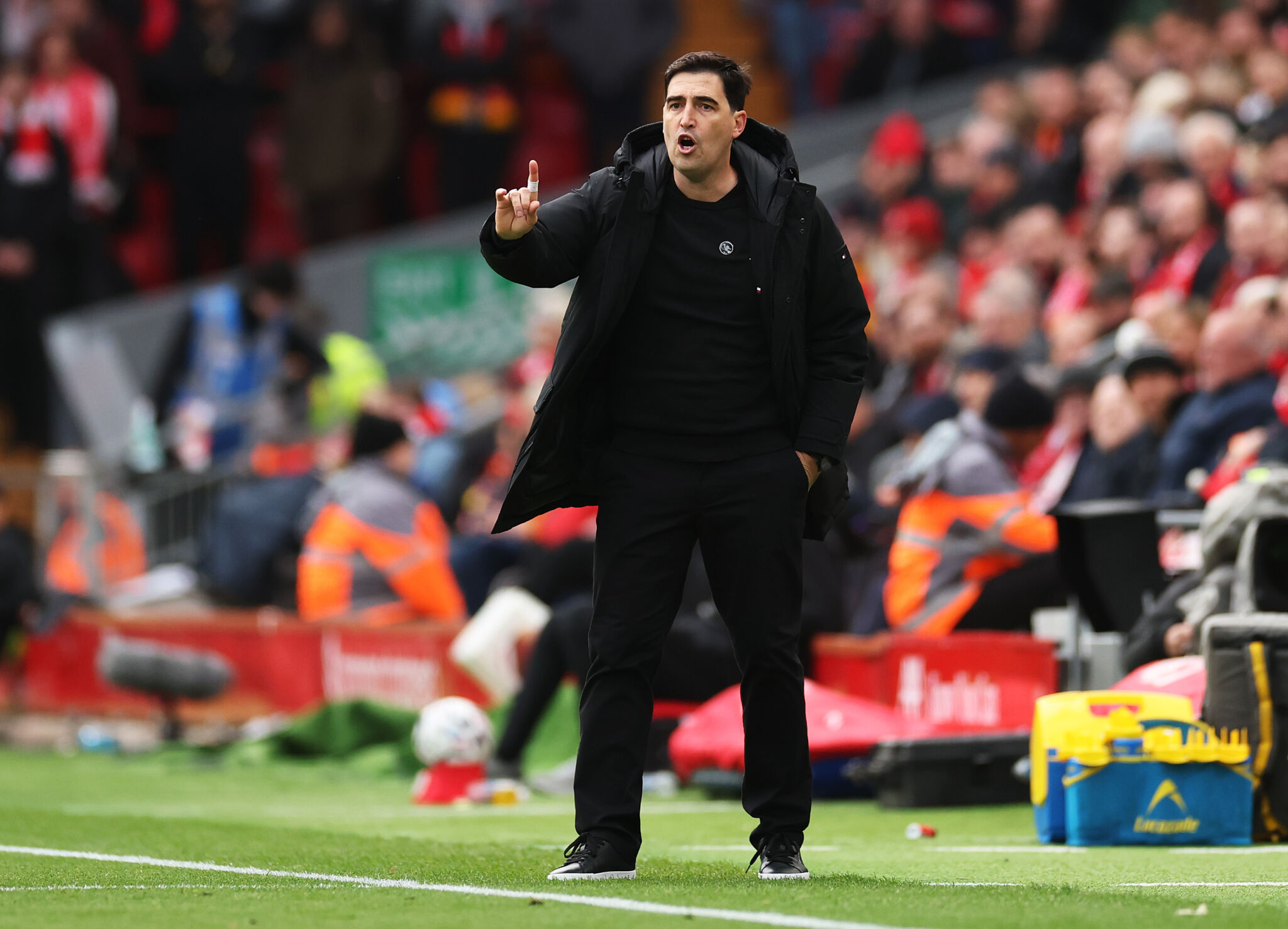 Andoni Iraola signals to his Liverpool players during a match at Anfield