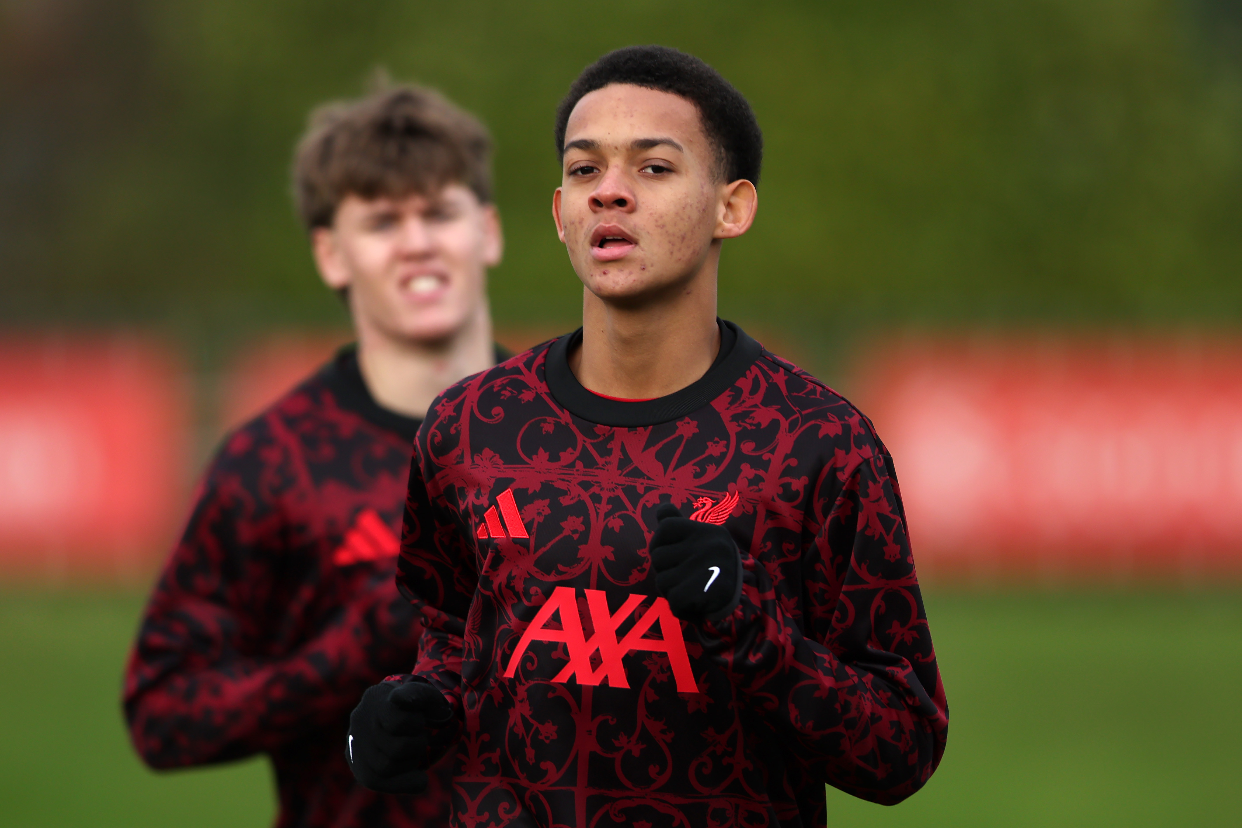 Josh Sonni-Lambie warms up prior to a UEFA Youth League fixture for Liverpool