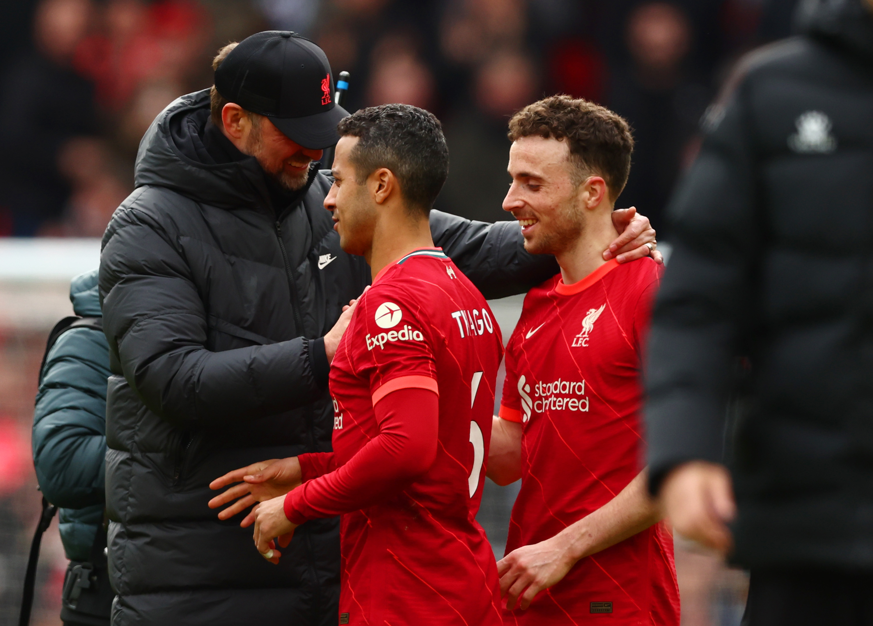 Jurgen Klopp celebrates with Thiago Alcantara and Diogo Jota in 2022