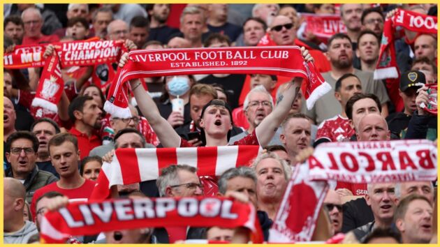 Liverpool fans hold up scarves prior to kick-off at Anfield