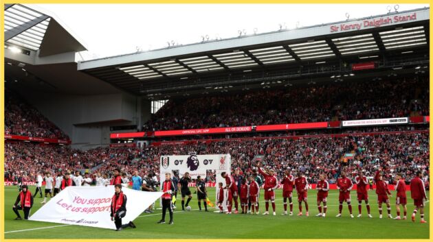 Liverpool players line up prior to their match against Fulham