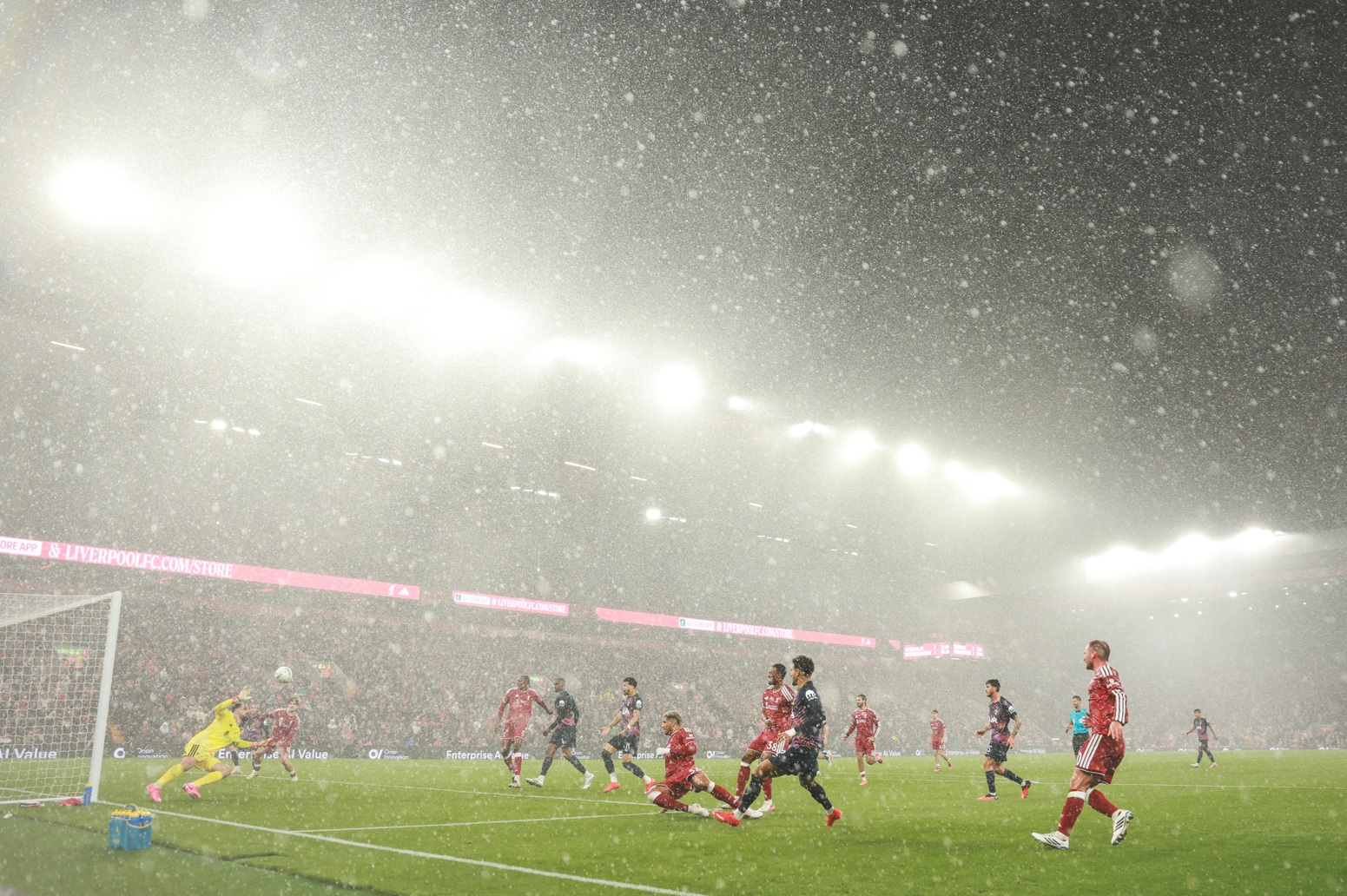 Liverpool take on Spurs at Anfield as heavy rainfall batters the players