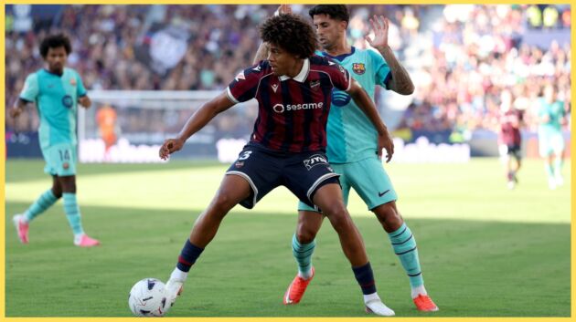 Ifeanyi Ndukwe shields the ball from Joao Cancelo
