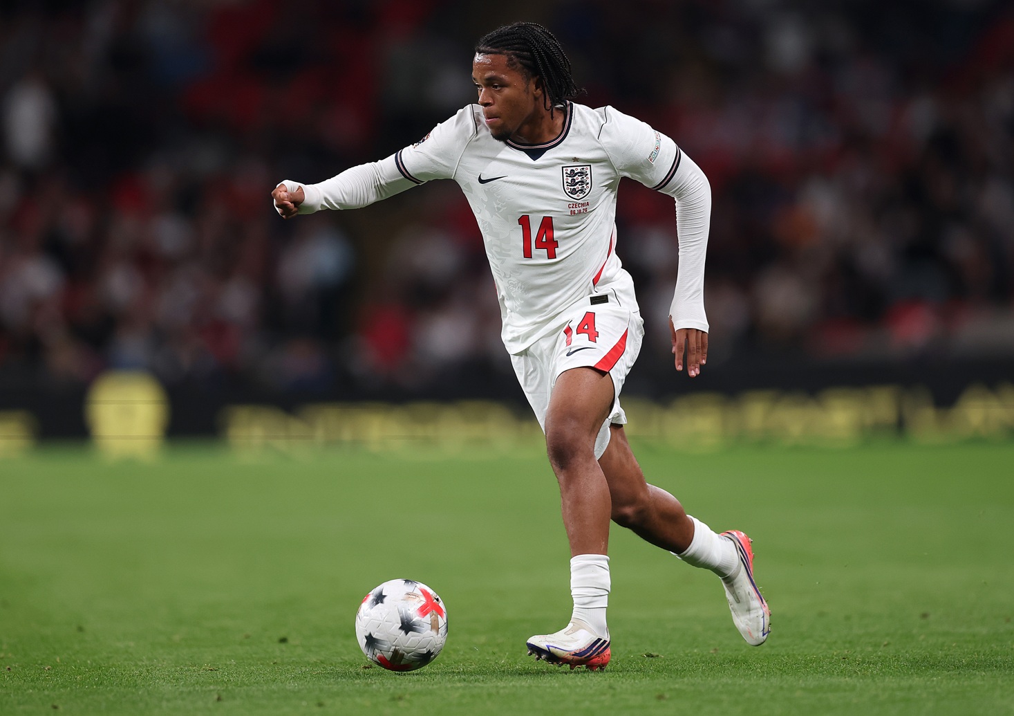Rio Ngumoha runs with the ball during a match for England
