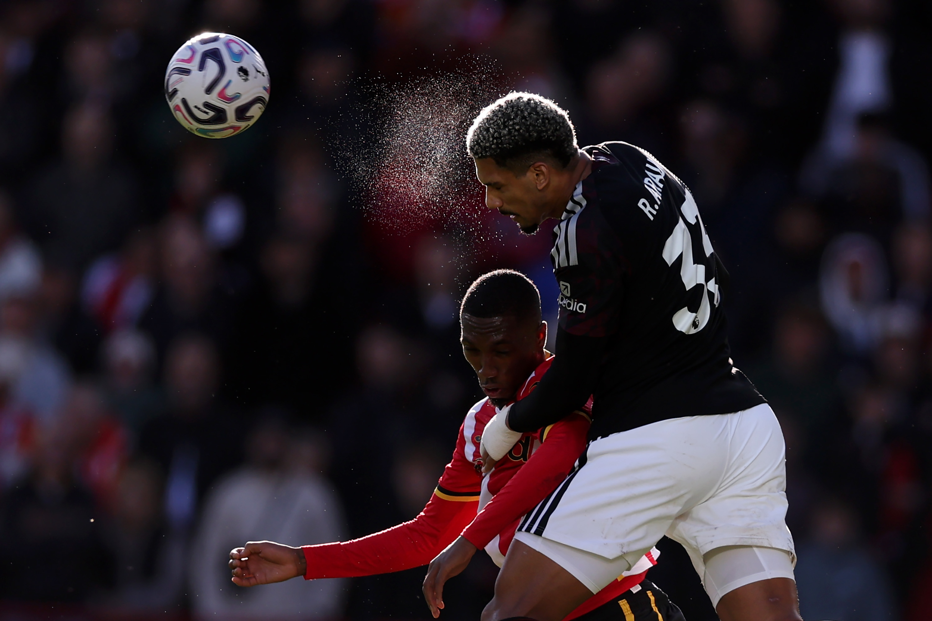 Ronald Araujo gets above Jaidon Anthony to win a header for Liverpool