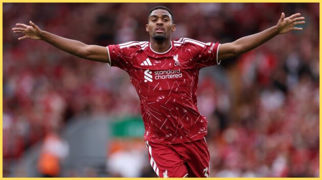 Ryan Gravenberch holds his arms aloft during a match at Anfield