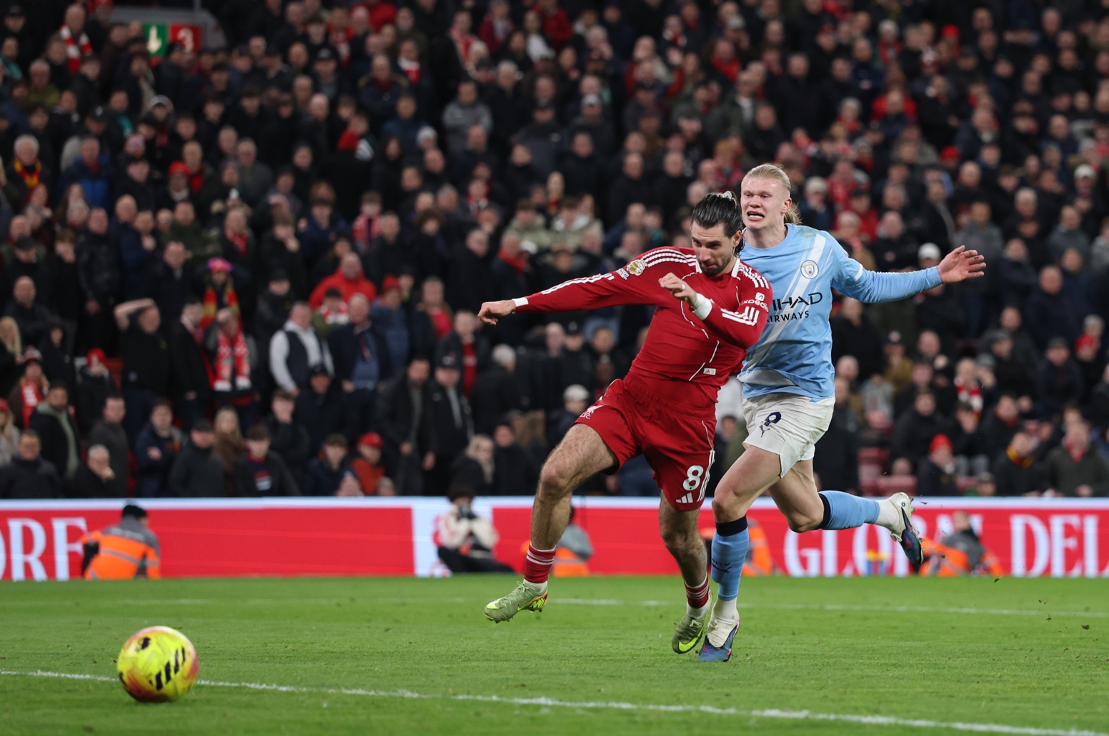 Dominik Szoboszlai and Erling Haaland tussle during Liverpool's clash at home to Man City last season