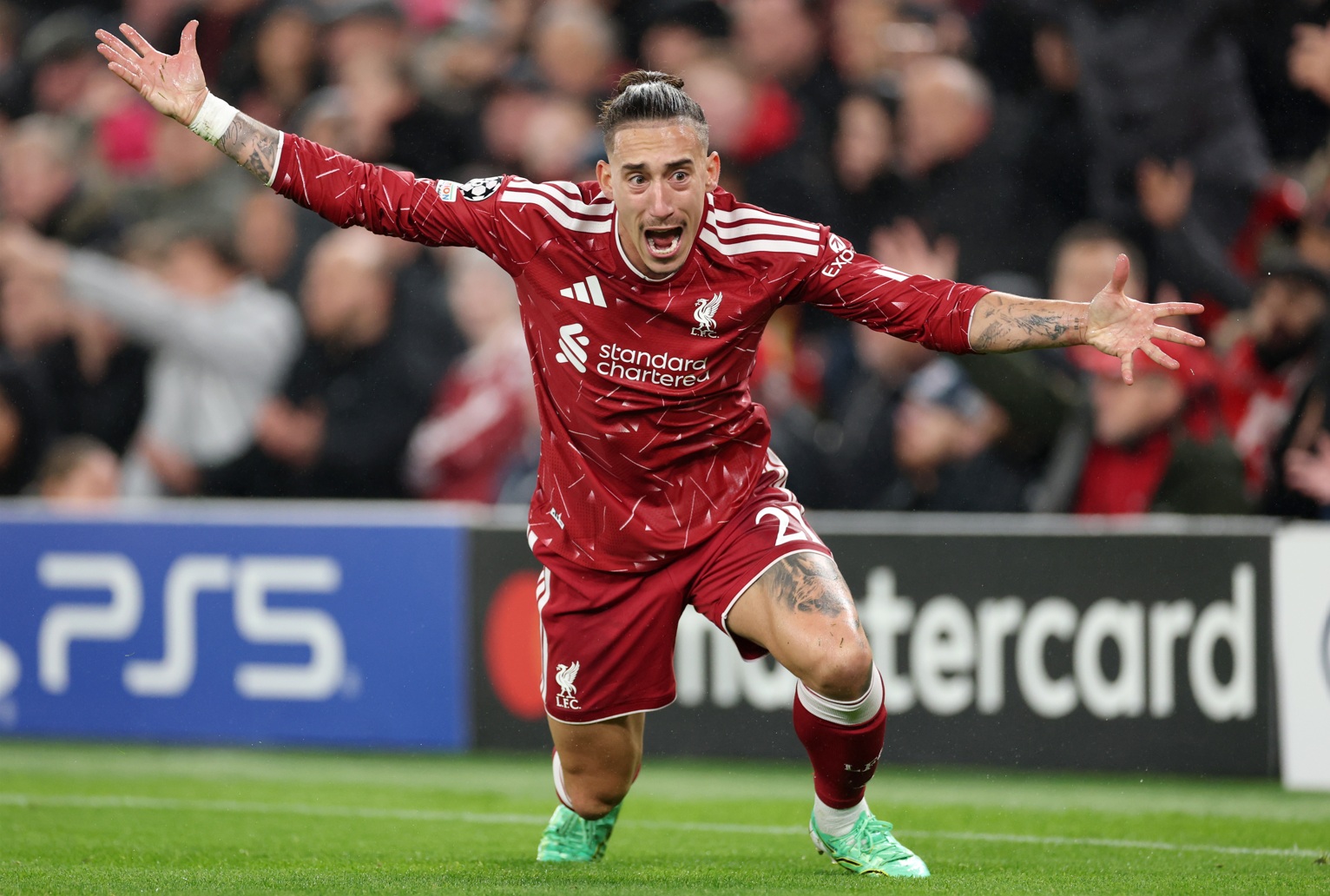 Kostas Tsimikas reacts during a Champions League game for Liverpool