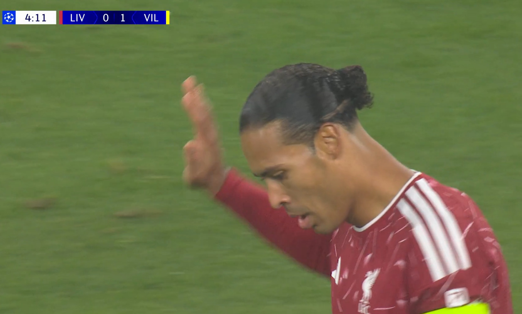 Virgil van Dijk holds his hand up after his early error gifted Villarreal a goal