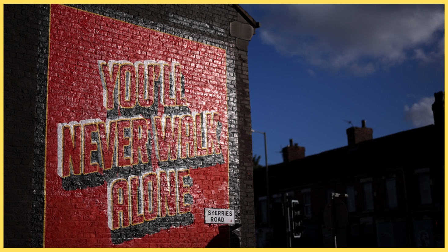 A mural depicting the words 'You'll Never Walk Alone' near Anfield
